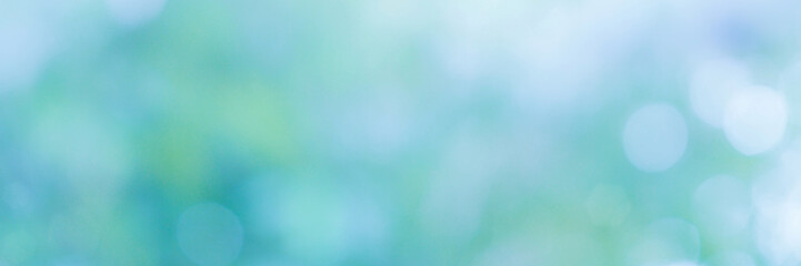 Abstract natural green bokeh background. Spring background - abstract banner - green blurred bokeh lights