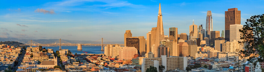 Fototapeta na wymiar San Francisco skyline panorama at sunset with Bay Bridge and downtown skyline