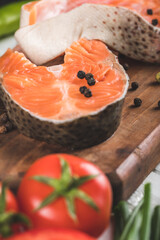Salmon slices with tomatoes and pepper