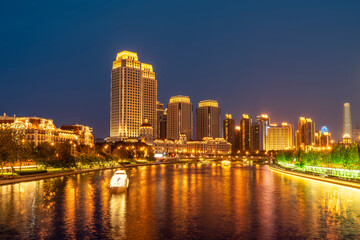 Fototapeta na wymiar Night view of architecture along Haihe River in Tianjin