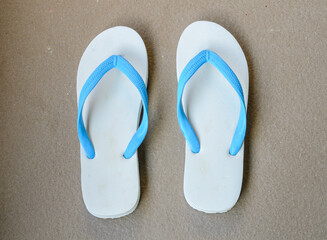 A pair of white slippers