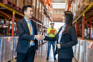 Business people shake hands in the warehouse,Wholesale,Logistic, People and export concept.