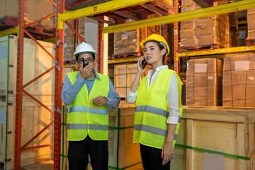 Worker working use radio to communicate in the large warehouse,Wholesale,Logistic,People and export concept.