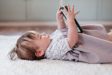 Baby playing with a cell phone