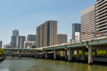 Fototapeta na wymiar Office buildings along Dojima river in Osaka, Japan