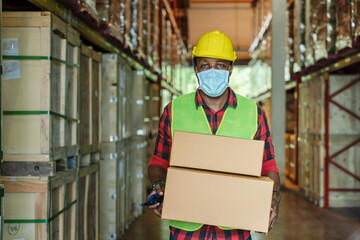 factory worker working with face mask to protect coronavirus covid-19