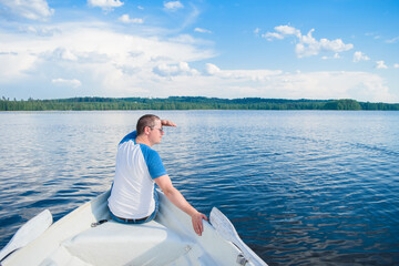 Man sitting on the boat.