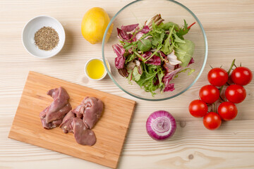 Warm salad with chicken giblets