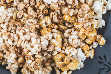 Popcorn with caramel corn and kettle corn on blue background