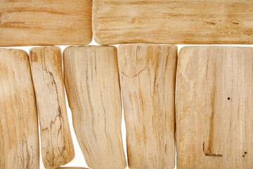 Driftwood wall decor. pieces of wood isolated on white background. Minimalism style.Marine style interior. Decor from natural materials. Nature wooden texture background.Summer home decor