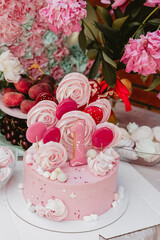 
festive pink birthday cake in one year of life