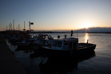 Small fishing boats seen at the port of a fishing village on the mediterranean coast of Turkey....