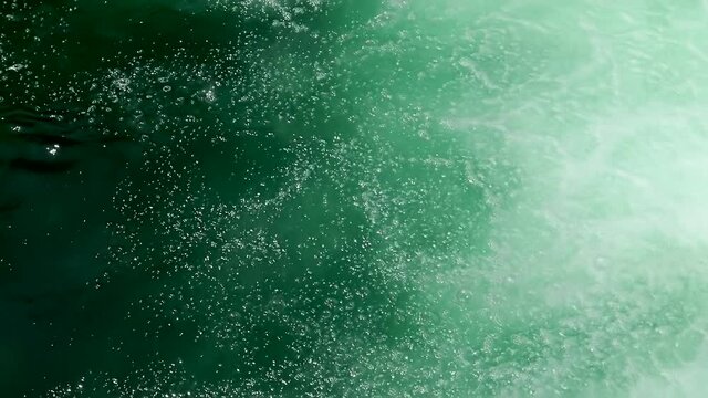 A cool fresh mountain river water makes air bubbles.