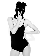 Beautiful sexy woman in black swimwear bathing suit. Model wearing bandit balaclava mask.Hot girl...