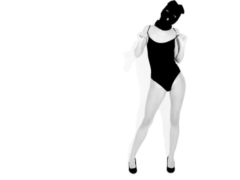 Beautiful sexy woman in black swimwear bathing suit. Model wearing bandit balaclava mask.Hot girl posing near white wall in studio.Seductive female in nice lingerie.Crime and violence