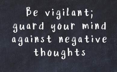 Chalk inscription of smart quote on black desk