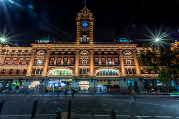 Melbourne, Australia - 05th March 2020: A german photographer visiting the Flinders Street, taking pictures of the Railway Station at night as a long exposure.