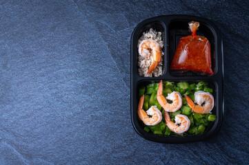 Freshly packed box food for customers who working in the office, new normal way of life that is convenient to order food online and use delivery services, with copy space background
