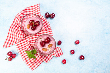 Traditional homemade italian delicious dessert pannacotta with cherry jelly on a light background, banner menu recipe place for text, top view