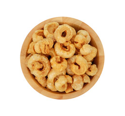 Pork snack, pork rind, pork scratching, pork crackling in wooden bowl  isolated on the white background, top view.