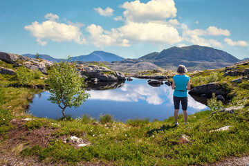 Women hike to Vikerheia a great summer day in Nordland county