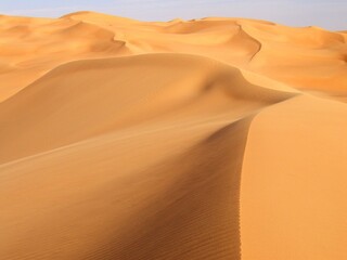 Fototapeta na wymiar Libya. Desert landscape with sand dunes around the town of Sebha.