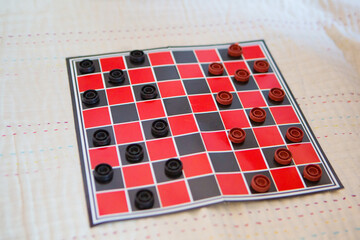 checkers close-up. black and red map. games for development of logic