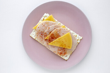 Salty crackers with sausage chicken, cheese and paprika