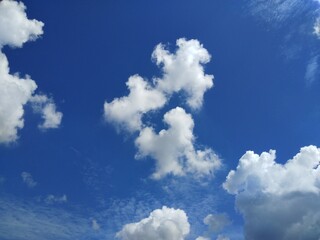 Naklejka na ściany i meble dramatic clouds and blue sky