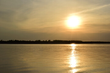 Golden sunset over a calm river.