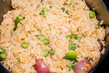 Homemade Chinese fried rice with vegetables, Veg Schezwan Fried Rice, peas, peppers, green beans, carrot. Selective Focus, Top view
