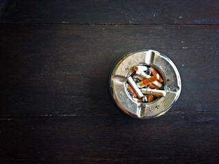 cigarette tray on the wooden table