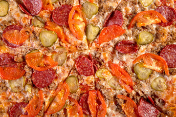 close up of a pizza with vegetables and meat