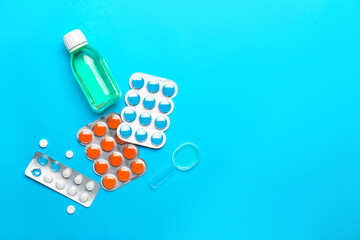 Cough medicines on color background