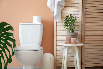 Modern toilet bowl in interior of restroom