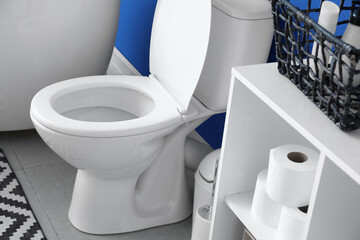 Modern toilet bowl in interior of bathroom