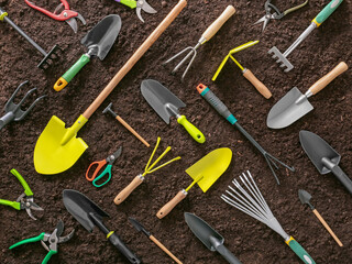 Tools for gardening on soil background