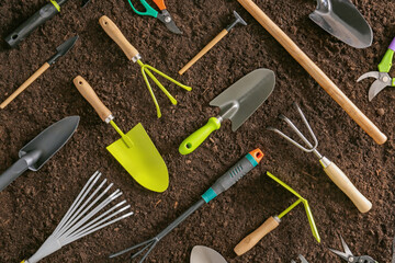 Tools for gardening on soil background