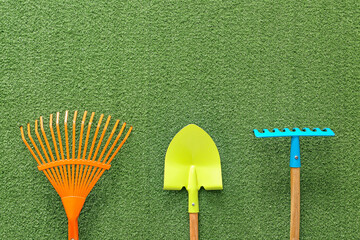 Supplies for gardening on color background