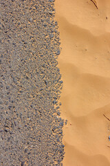 The boundary of sand and asphalt