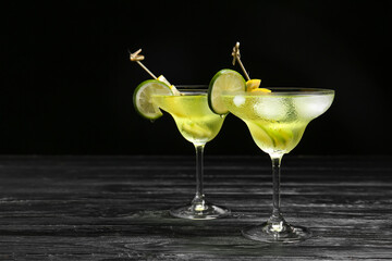 Glasses of tasty martini cocktail on table