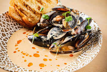 Plate of mussels with creme dubarry in restaurant
