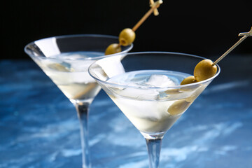 Glasses of tasty martini cocktail on table