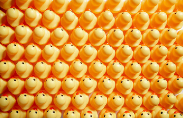 a lot of rubber ducks standing in a order