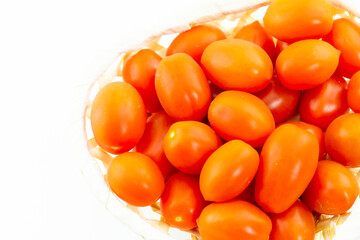 tasty and appetizing cherry tomato bunch of vegetables bright red on a white background