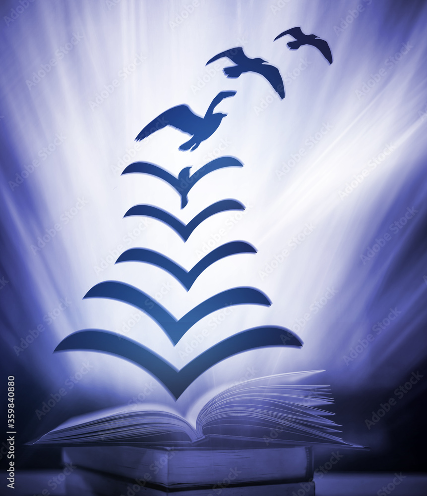 Poster a fantasy abstract image opens the book where the paper floats out of the book, turning into a bird 