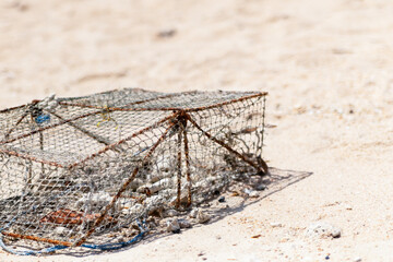 crab trap traditional iron fishing asia on sand background