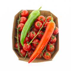 pair of red and green chili peppers on a background a branch cherry tomatoes the basis for the sauce on a white isolated background