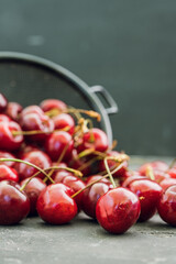 Ripe and juicy cherries on the dark rustic background. Selective focus. Shallow depth of field.
