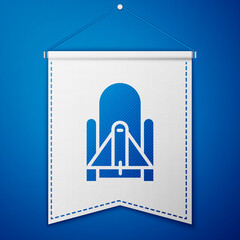 Blue Rocket launch from the spaceport icon isolated on blue background. Launch rocket in space. White pennant template. Vector Illustration.